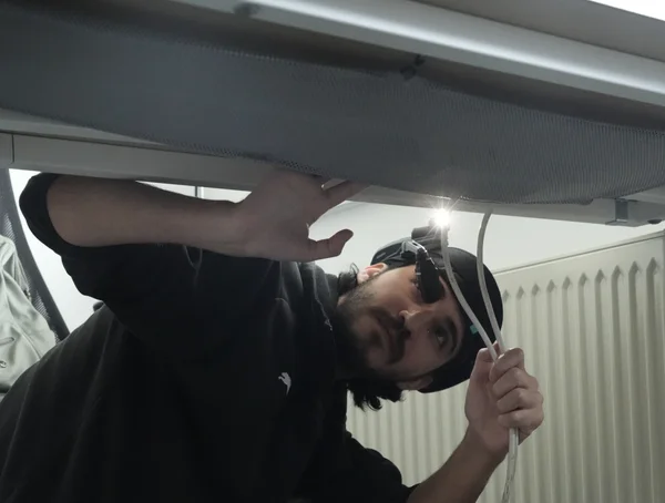 A technician wearing Osra+ AR glasses