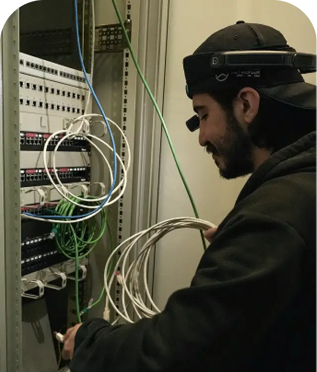A technician working while wearing Osra+ AI glasses